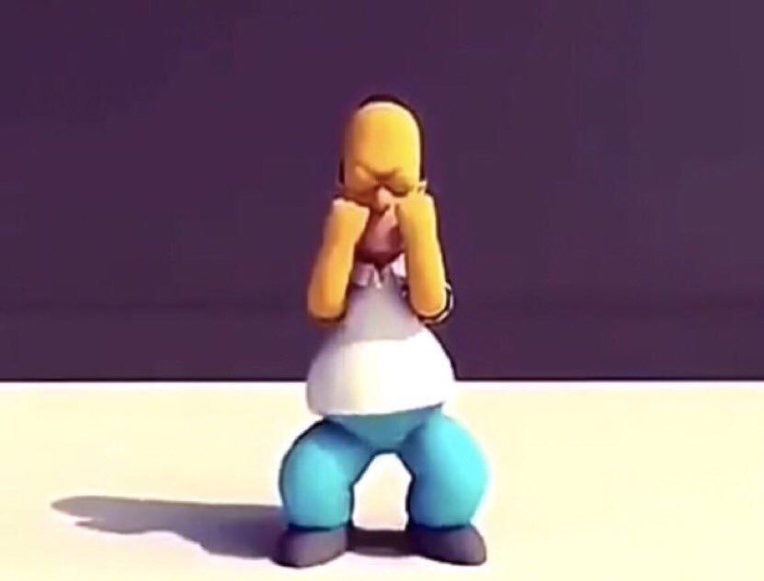 3D clay Homer Simpson crouching with his face buried in his hands