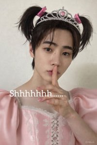 Young person in a pink princess dress and tiara pressing a finger to their lips with text 'Shhhhhhh......'