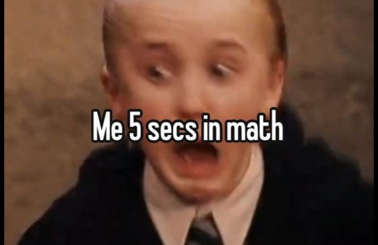 Young Draco Malfoy gasping in shock under 'Me 5 secs in math'