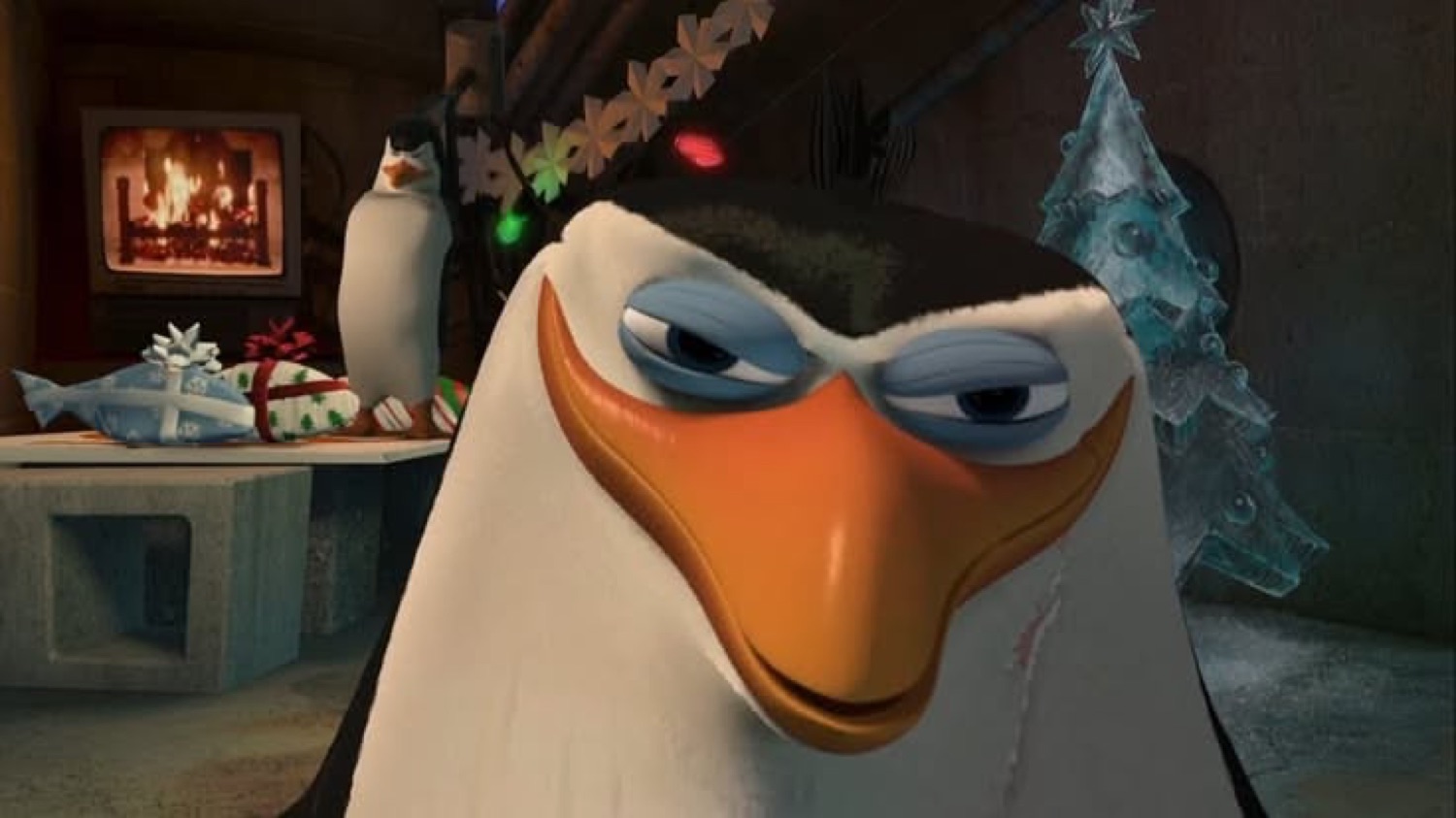 Skipper from Penguins of Madagascar squinting skeptically in a Christmas-decorated room
