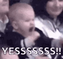 Baby in a stadium crowd cheering wildly, "Yessssssss!!"