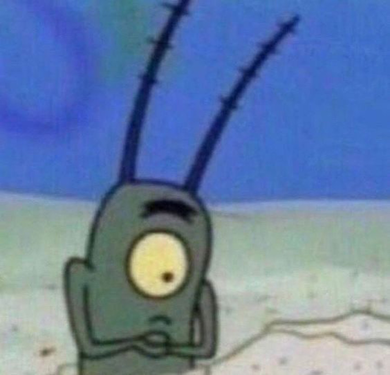 Plankton from SpongeBob standing on the seafloor with a vacant, dazed stare