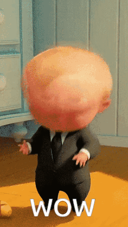 The Boss Baby in a suit with wide eyes, "Wow"