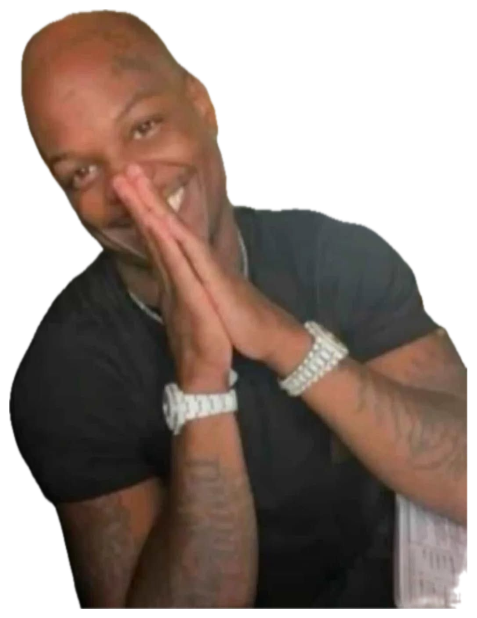 Man at a bar resting his chin on clasped iced-out wrists with a sly grin sticker
