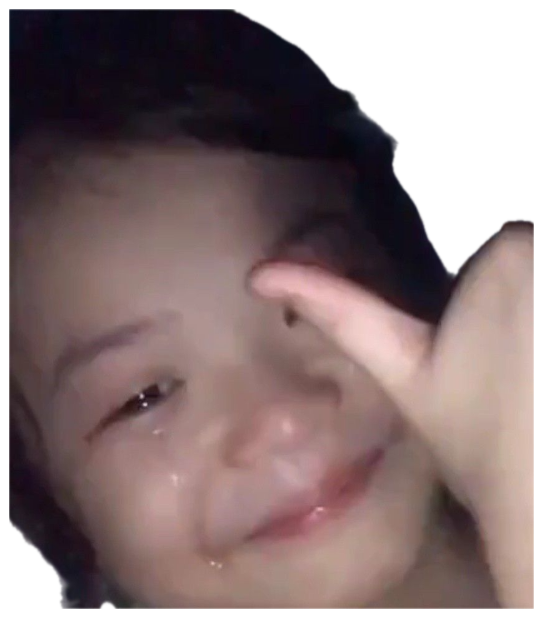 Girl crying and smiling simultaneously while pointing at her own tear-streaked face sticker