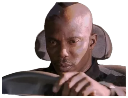 Bald man in a car driving with a flat, checked-out deadpan stare sticker