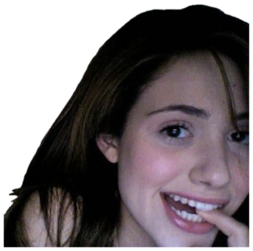 Young woman beaming with a playful grin, finger at her lip sticker