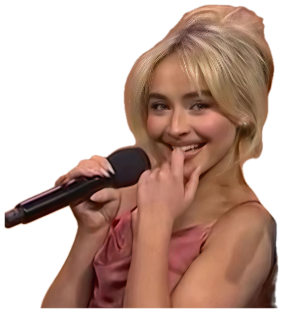 Blonde woman laughing shyly while holding a microphone at an interview sticker