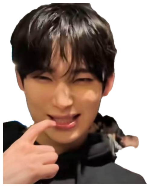 Young man with a sly squint and grin, finger resting on his lower lip sticker