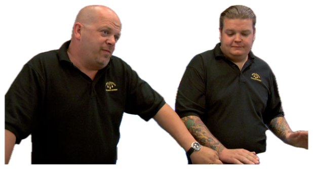 Two Pawn Stars guys behind the counter, one shooting a skeptical sideways look sticker