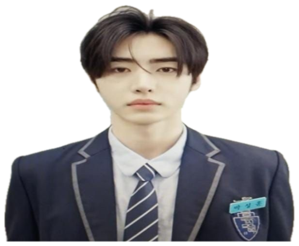 Young man in school uniform staring forward with zero expression, captioned 'My honest reaction' sticker