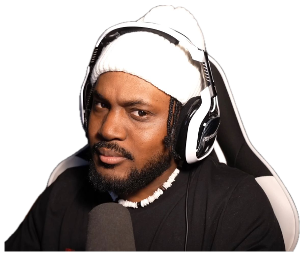 A man in a headset and beanie giving the camera a flat, unimpressed side glance at his mic sticker