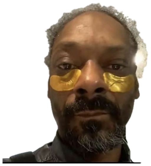 Snoop Dogg selfie in gold under-eye patches wearing a completely deadpan face sticker