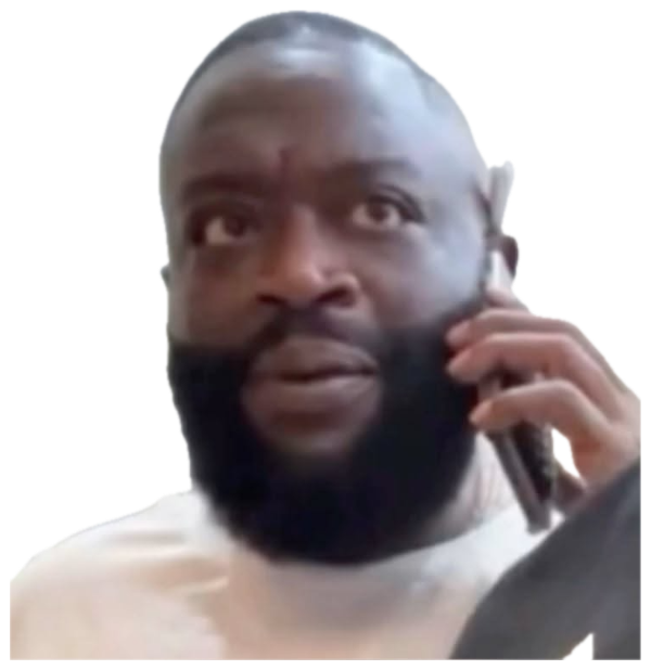Man with a large beard staring blankly ahead while someone off-frame smiles sticker