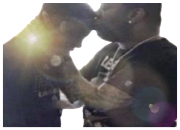 Grainy backlit photo of two people leaning in close for a kiss sticker