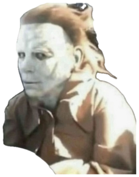 Person in a Michael Myers mask sitting in a car seat with a blank, deadpan stare sticker
