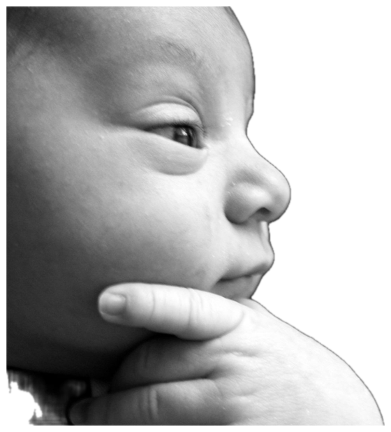 Black-and-white close-up of a baby resting its chin on its hand with a pensive, thoughtful look sticker
