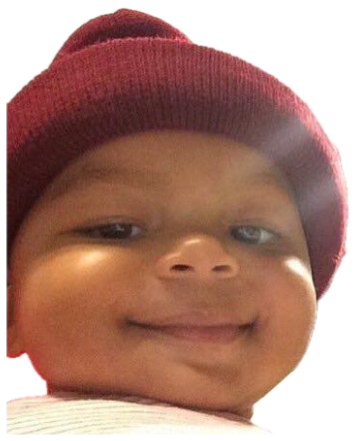 Chubby baby in a red beanie giving the smuggest little smile straight at the camera sticker