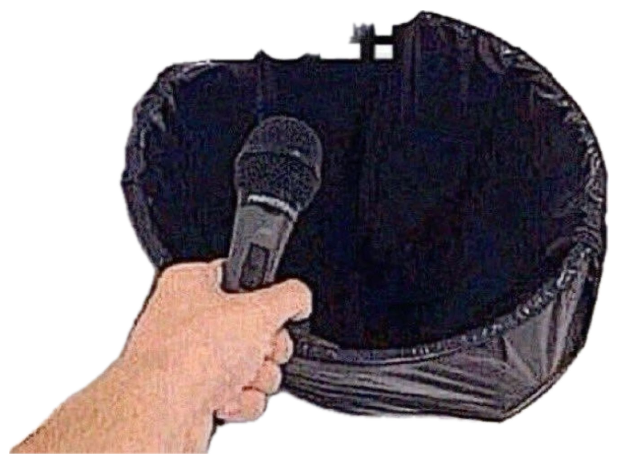 Hand holding a microphone up to an open trash bag captioned 'ANYTHING ELSE?' sticker