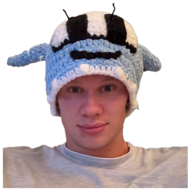 Blond guy in a knitted bee hat with a totally deadpan face sticker
