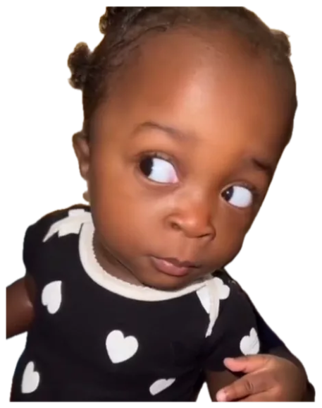 Baby in a heart-print onesie throwing a slow, doubtful side-eye sticker