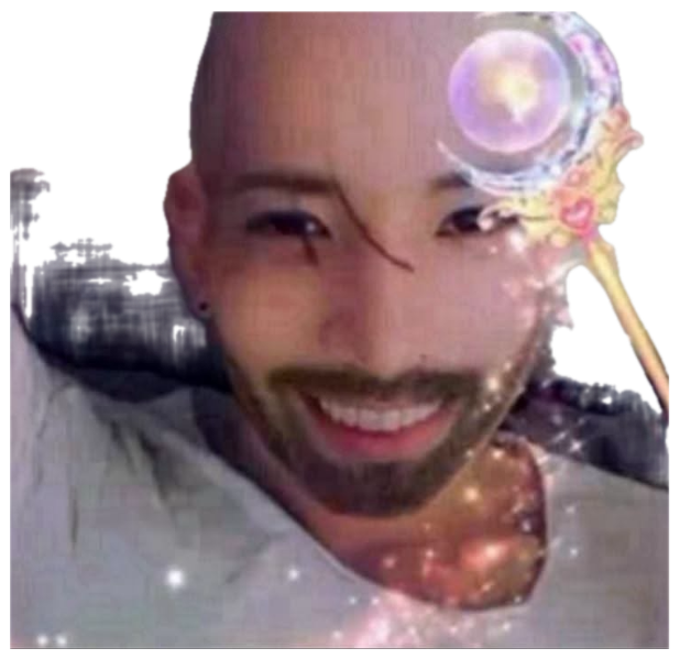 Bald bearded guy grinning in bed under a glittery magic-wand sparkle filter sticker