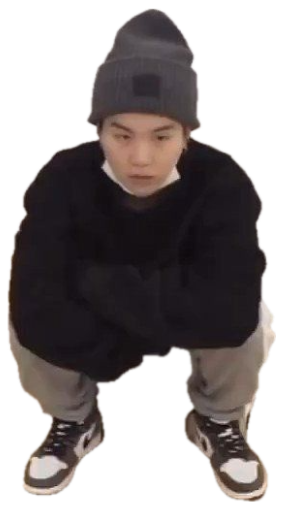 Guy in a beanie and black sweater squatting on the floor with a flat, blank stare sticker