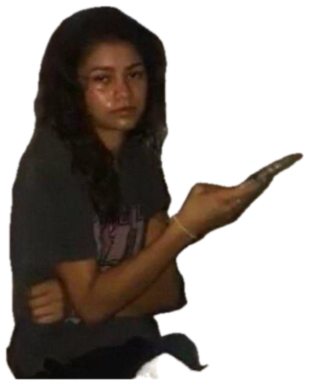 Teary young woman sitting on a bed pointing a phone at the camera with a fed-up look sticker