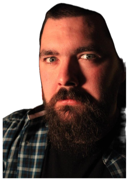 Bearded man with piercing blue eyes staring intensely from a dark, dramatically lit photo sticker