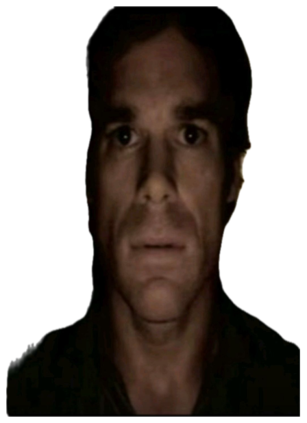 Man's face half-lit in a dark room with an empty, exhausted blank stare sticker