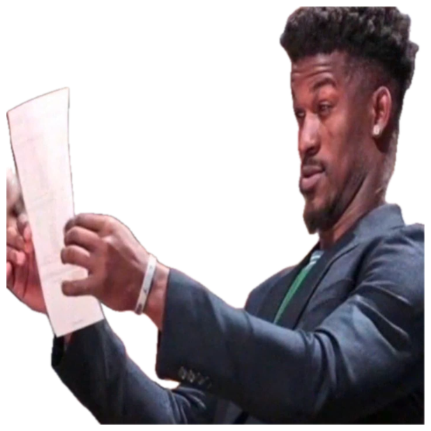 Man in a suit courtside squinting skeptically at a sheet of paper he's holding up sticker