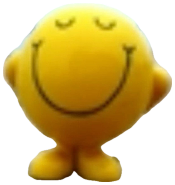 Mr. Happy smiley face toy on a beach with eyes closed and a calm contented smile sticker