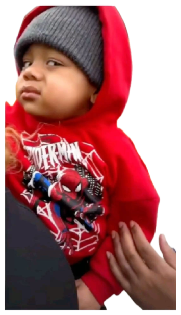 Toddler in a Spider-Man hoodie and beanie shooting a flat, unimpressed side glance sticker